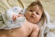 a little boy lying on sofa