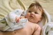 a little boy lying on sofa