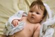 a little boy lying on sofa