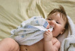 a little boy lying on sofa