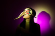 Girl with big nosed mask (left)