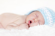 Newborn baby sleeping. Soft focus, shallow DoF.