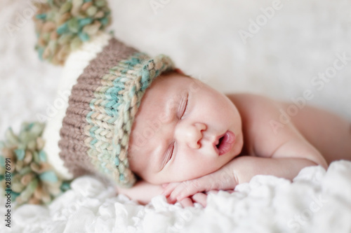 Photo: Newborn baby sleeping. Soft focus, shallow DoF. Newborn baby sleeping. Soft focus, shallow DoF.