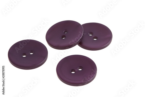 Photo: Sewing buttons on a white background Sewing buttons on a white background