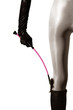 Girls leg in white jodhpurs with pink whip