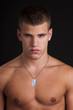 sexy male model topless with a military identification disc sexy male model topless with a military identification disc