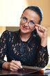Young pretty woman sitting at a table Young pretty woman sitting at a table