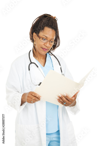 Photo: Pretty Doctor Reads Medical Chart Pretty Doctor Reads Medical Chart