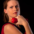 Young woman athlete raising dumbbell