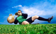 Jump of football goalman on the outdoor field