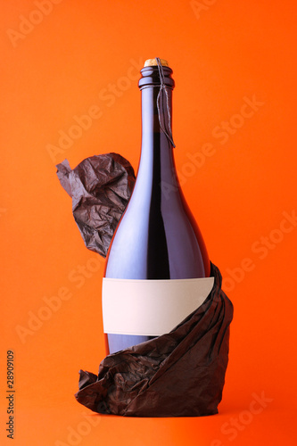 Photo: Black bottle of prosecco with blank label Black bottle of prosecco with blank label
