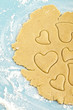 Making heart shaped shortbread cookies with cutters, dough