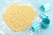Making heart shaped shortbread cookies with cutters, dough