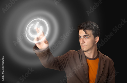 Photo: man pressing a touchscreen button man pressing a touchscreen button