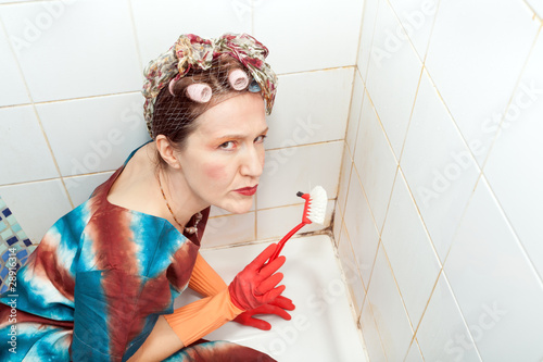 Photo: angry woman and dirty bathroom angry woman and dirty bathroom