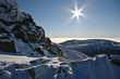 Winter view with rocks and sun