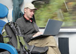 Tourist with laptop in the train