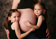 Mom's pregnant belly and sisters