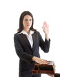 Photo: Woman Hand Raised Swearing on a Stack of Bibles Isolated White Woman Hand Raised Swearing on a Stack of Bibles Isolated White