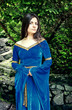Photo: beautiful princess standing near trees beautiful princess standing near trees