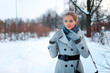 Portrait of beautiful young girl in winter day