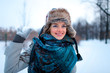 Portrait of beautiful young girl playing with snowball