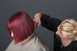 Hairdresser cutting customer's hair
