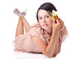 a young woman is laying on a floor and holding a flower in her h