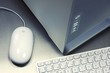 Close-up of PC desktop, keyboard, mouse on metal background