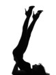 Photo: silhouette woman liying on floor gymnastic legs silhouette woman liying on floor gymnastic legs