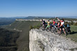 Photo: A group of five adults on bicycles in the countryside. A group of five adults on bicycles in the countryside.