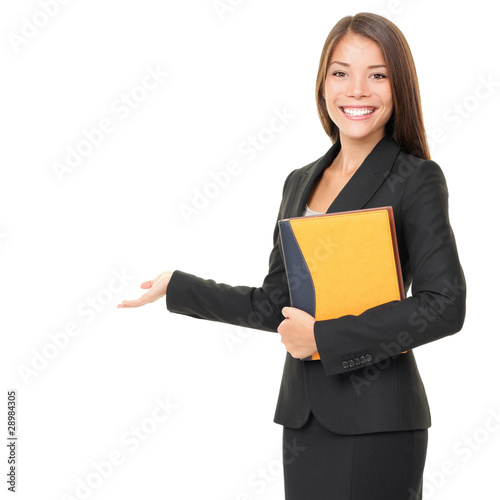 Photo: Business woman showing white copy space Business woman showing white copy space