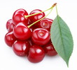 Group ripe cherries with a leaf on a white background.