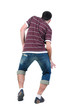 Young man dancing. Rear view. Young man dancing. Rear view.