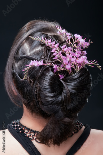 Photo: Evening hairstyle with flowers. Evening hairstyle with flowers.