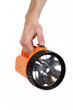 orange plastic flashlight in hand isolated on white background