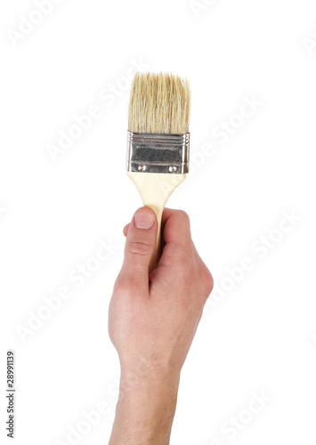 Photo: Hand with brush isolated on white background Hand with brush isolated on white background
