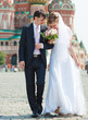 Young wedding couple walking