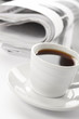 Cup of fragrant coffee on a morning paper business news Cup of fragrant coffee on a morning paper business news
