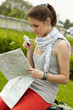 traveler girl searching for her destination on the map traveler girl searching for her destination on the map