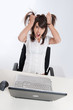 Foto: Desperate young woman with computer Desperate young woman with computer