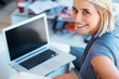 Happy woman working on laptop