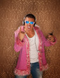Man in Pink Jacket Listens to Music