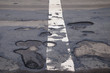 Foto: potholes in a road potholes in a road