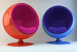 Two multi colored armchairs opposite each other Two multi colored armchairs opposite each other