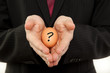 businessman with egg in the hands