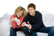 Attractive teenagers playing video games