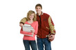 Attractive teenage couple holding books and football
