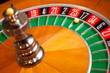 casino roulette close up with the ball on number zero