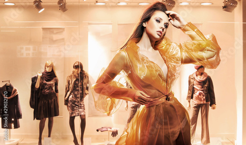 Photo: Sexy woman in front of a window shop Sexy woman in front of a window shop